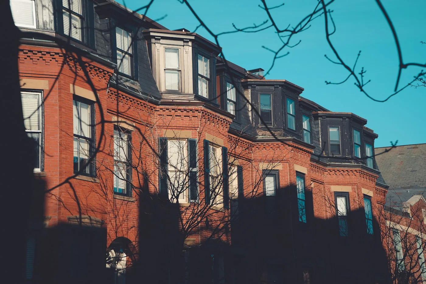Representative brick multifamily and apartment buildings in Boston